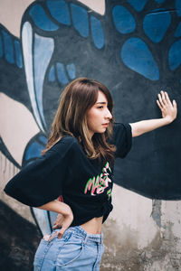 Full length of young woman standing on floor