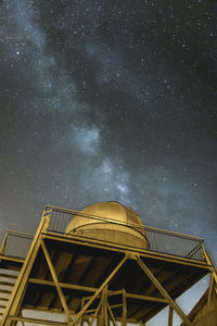 Low angle view of building against sky at night