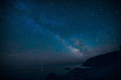 Scenic view of star field against sky at night