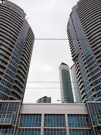 Low angle view of modern buildings against sky