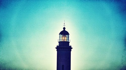 Low angle view of lighthouse against blue sky