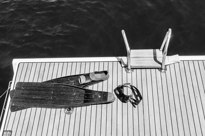 High angle view of diving fins on pier