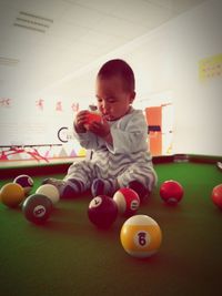 Boy playing with ball at home