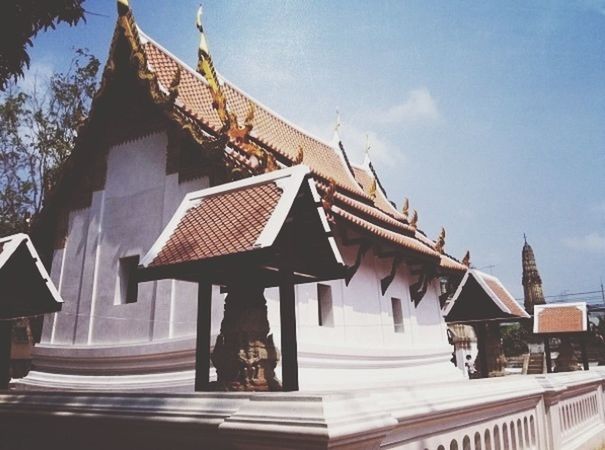 architecture, built structure, building exterior, low angle view, roof, place of worship, temple - building, religion, spirituality, sky, tradition, house, railing, art and craft, temple, steps, no people, day, outdoors