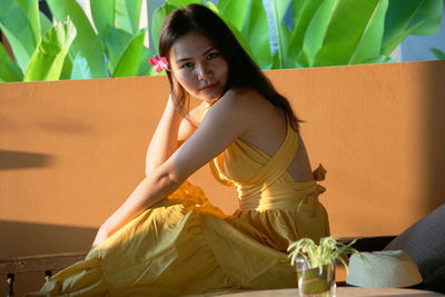 Portrait of woman sitting outdoors