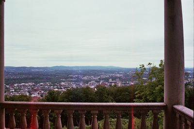 Cityscape against cloudy sky