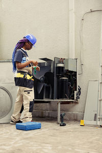 Side view of man working in gym