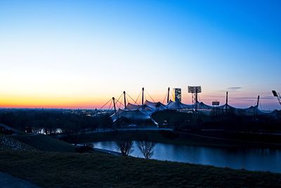Scenic view of river against sky at sunset