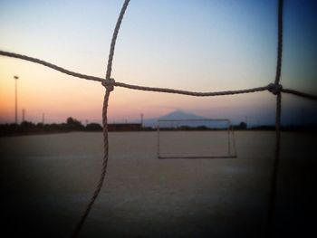 Chainlink fence at sunset