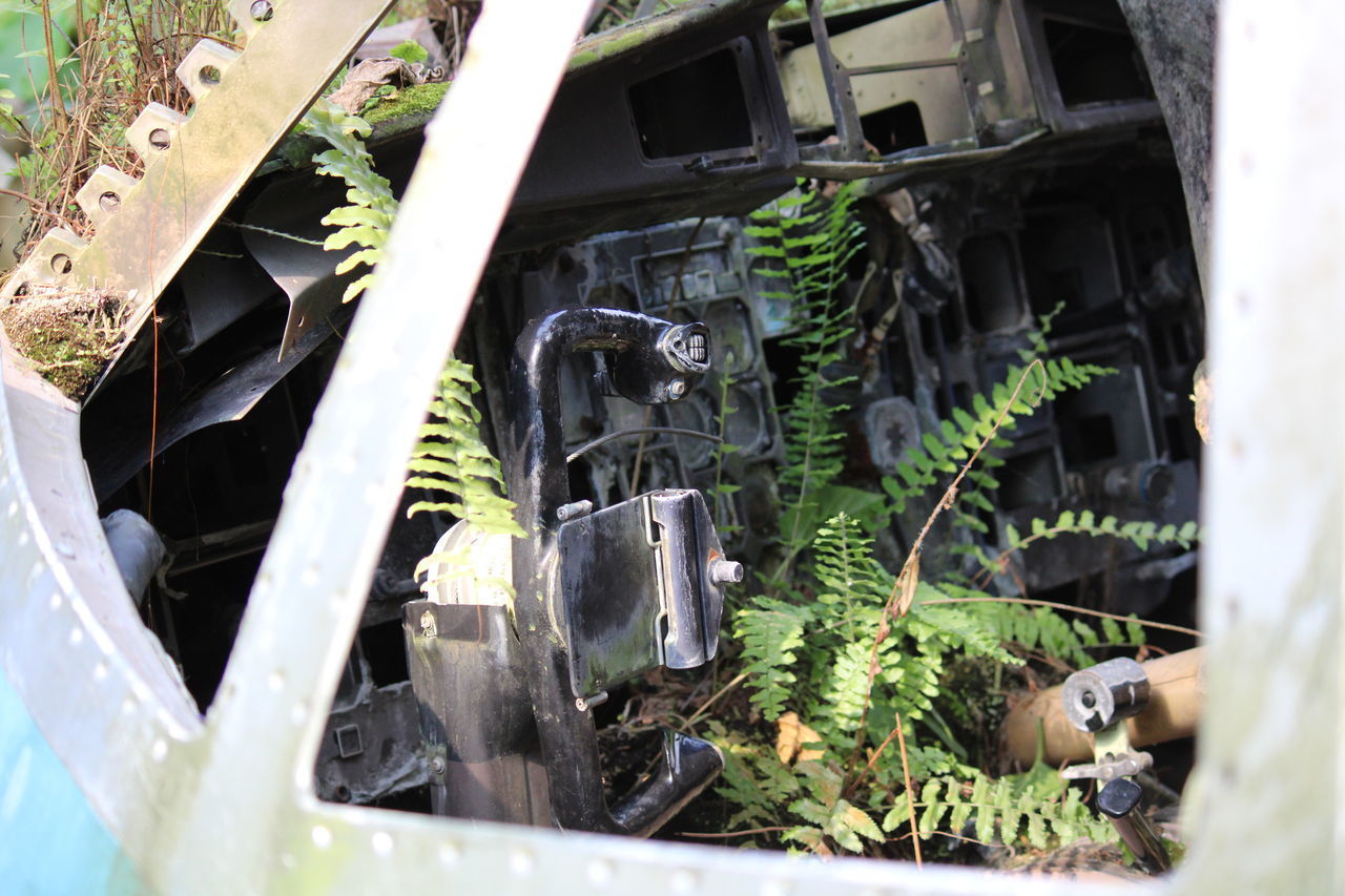 CLOSE-UP OF ABANDONED MACHINE PART