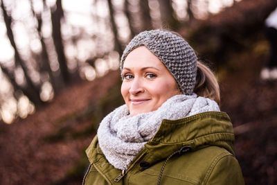 Portrait of smiling woman in forest