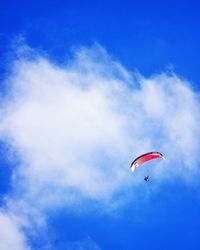 Low angle view of kite against blue sky