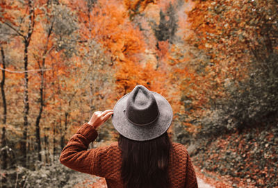 Full length rear view of man wearing hat during autumn