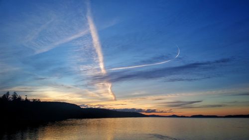 Scenic view of vapor trails against sky