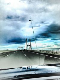 View of road against cloudy sky