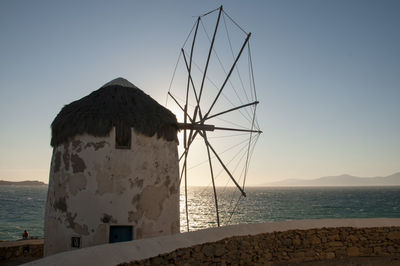 Close-up of an old windmill on the island of mykonos at sunset in greece.