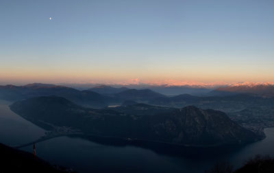 Scenic view of snowcapped mountains against sky during sunset