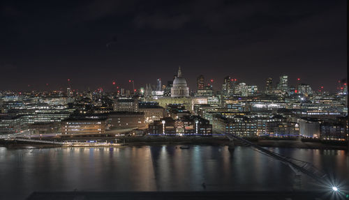 Illuminated buildings in city at night