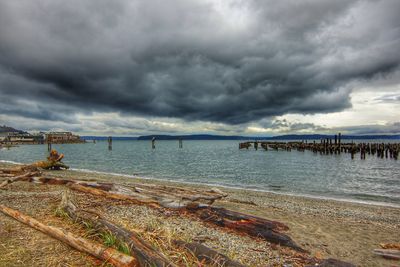 Scenic view of sea against cloudy sky