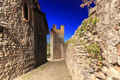 Stone wall against blue sky