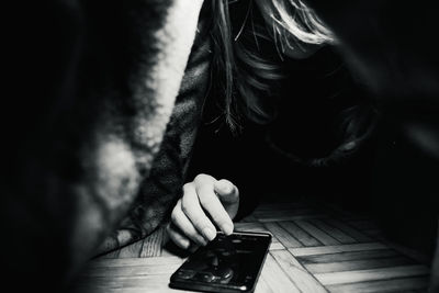 Close-up of woman using mobile phone