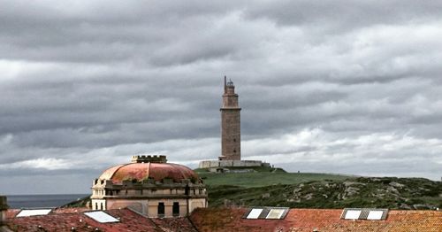 Tower amidst buildings against sky in city