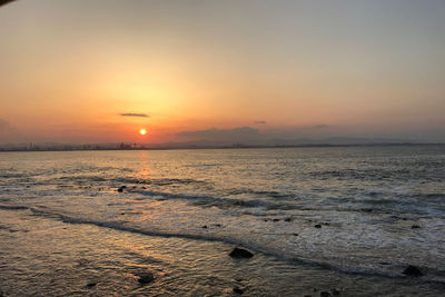 Scenic view of sea against sky during sunset