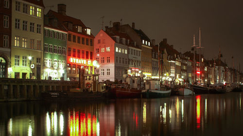 Reflection of buildings in water at night