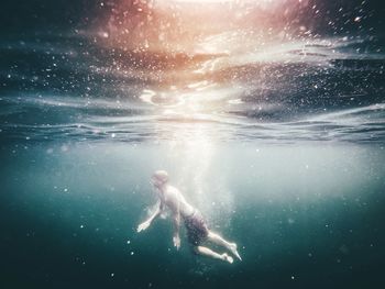 Woman swimming in sea