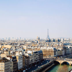 Distant view of eiffel tower against sky in city