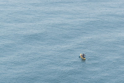 High angle view of man on boat in sea