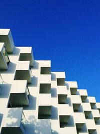 Low angle view of building against clear blue sky