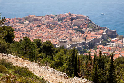 High angle view of townscape by sea