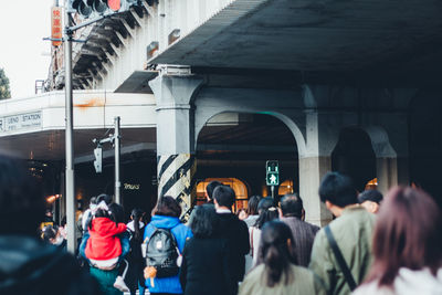 People walking on street in city