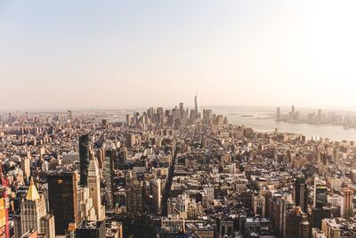 Aerial view of city buildings against clear sky