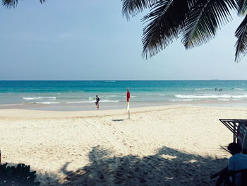 Scenic view of beach against clear sky