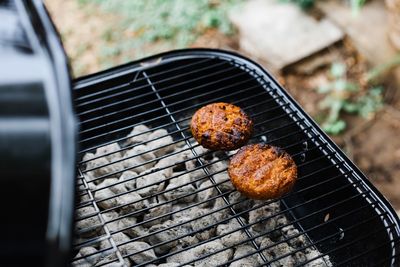 High angle view of meat on barbecue grill