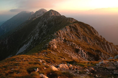 Sunset on high mountain ridge. piatra craiului, carpathians, romania