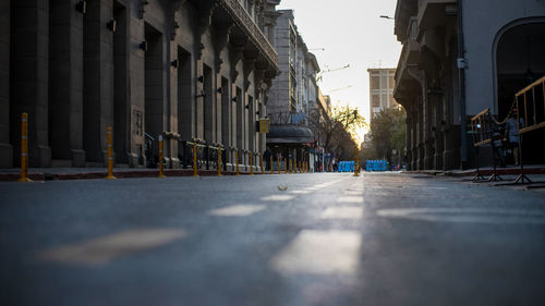 Surface level of street amidst buildings in city