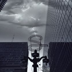 Low angle view of building against cloudy sky