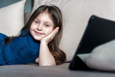 Portrait of a smiling girl sitting