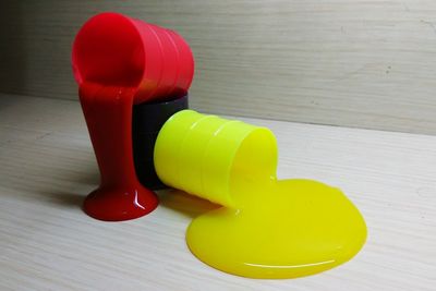 Close-up of yellow and red table