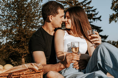 Young couple having a picnic in the park.