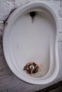 Cigarette butts in abandoned urinal