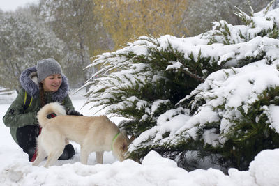 Girl with dog in winter