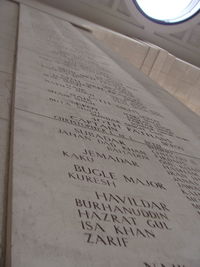 Close-up of text on sand