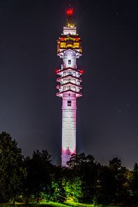 Low angle view of tower at night