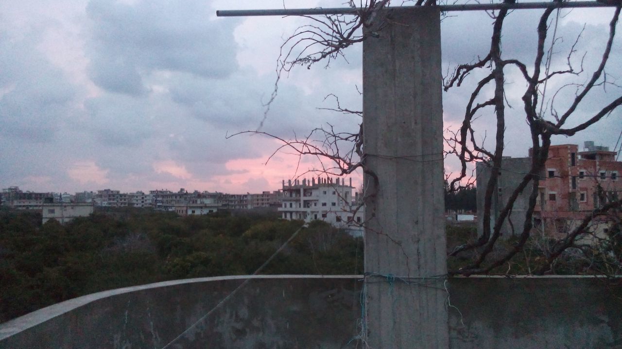 architecture, built structure, sky, building exterior, tree, bare tree, cloud - sky, branch, cloud, connection, house, cloudy, residential structure, residential building, city, no people, railing, outdoors, fence, nature