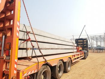 Cranes at construction site against clear sky