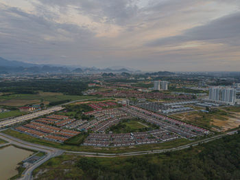 High angle view of road amidst buildings against sky